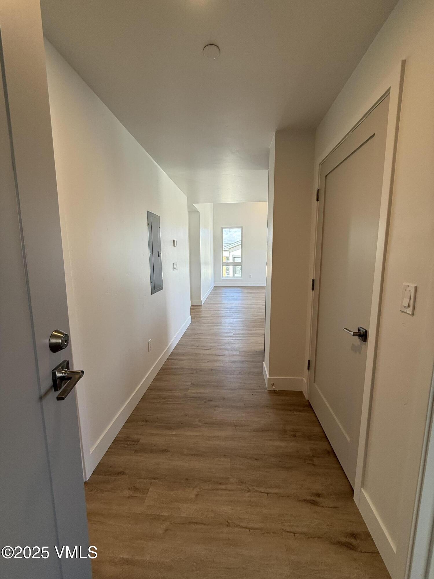 91 Mount Hope Circle, Unit G301 Eagle, CO 81631 - Photo 2 of 13 a view of a hallway with wooden floor