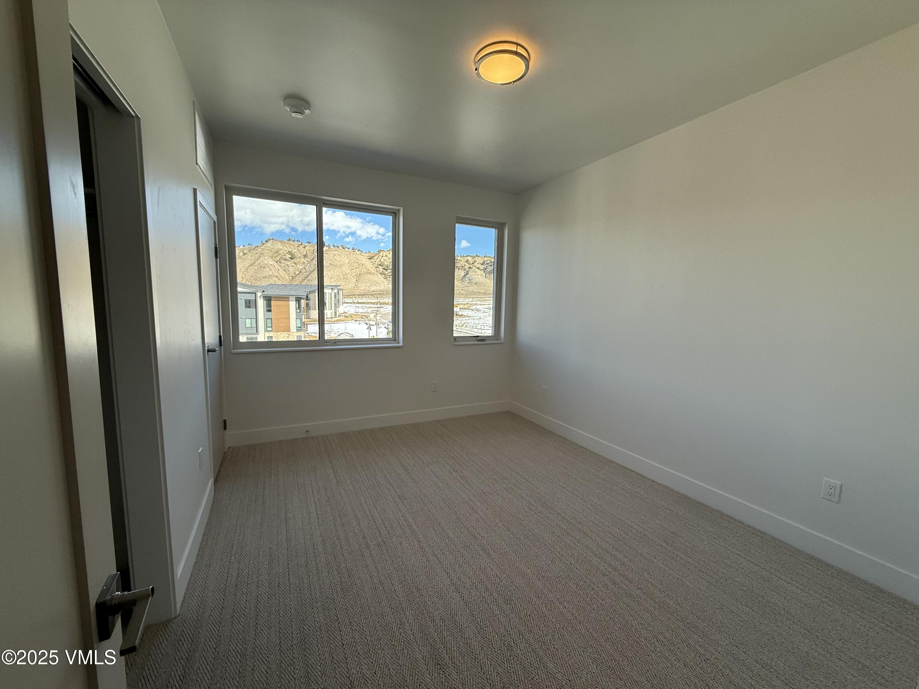 91 Mount Hope Circle, Unit G301 Eagle, CO 81631 - Photo 10 of 13 an empty room with a window