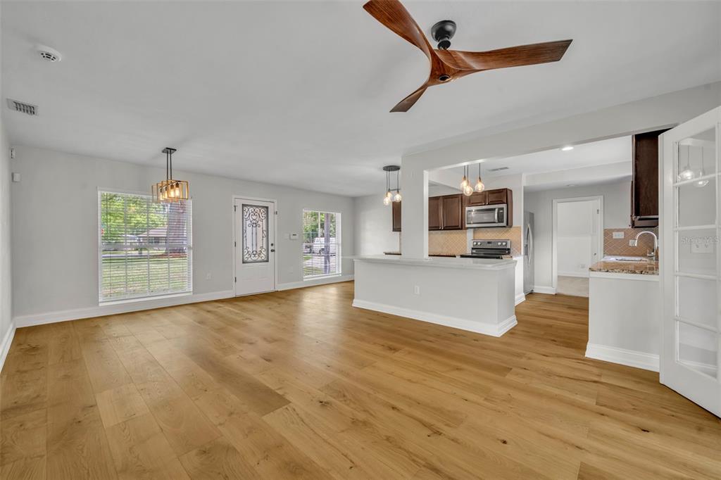 4234 Kendrick Road Orlando, FL 32804 - Photo 11 of 46 a view of an empty room with window and wooden floor