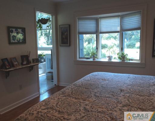 17 Woodlot Road East Brunswick, NJ 08816 - Photo 14 of 25 a living room with furniture and a window