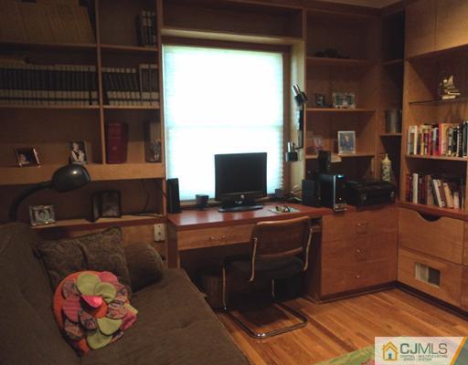 17 Woodlot Road East Brunswick, NJ 08816 - Photo 19 of 25 a room with furniture and a bookshelf