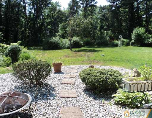17 Woodlot Road East Brunswick, NJ 08816 - Photo 24 of 25 a view of a garden with potted plants