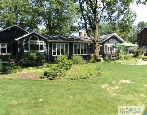 17 Woodlot Road East Brunswick, NJ 08816 - Photo 25 of 25 a front view of house with yard and green space