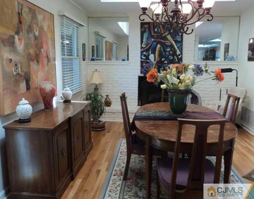 17 Woodlot Road East Brunswick, NJ 08816 - Photo 4 of 25 a view of a dining room with furniture and wooden floor