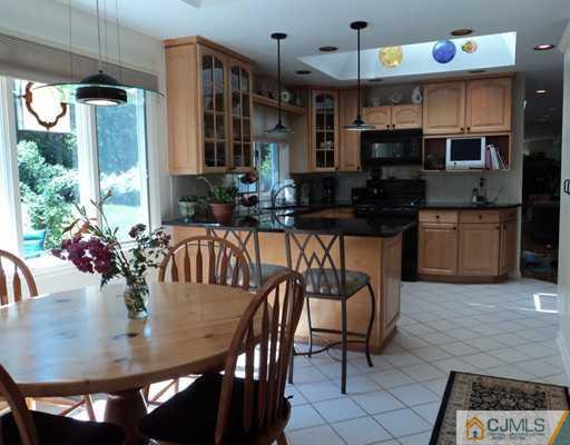 17 Woodlot Road East Brunswick, NJ 08816 - Photo 10 of 25 a view of a dining room with furniture window and wooden floor