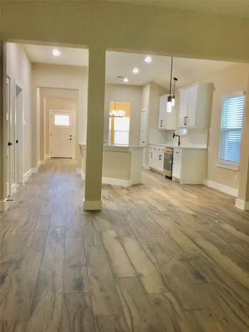 a view of a kitchen with a sink and a window