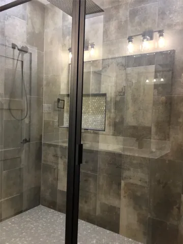 a view of water heater room with wooden floor