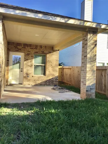 a view of backyard with plants and outdoor seating