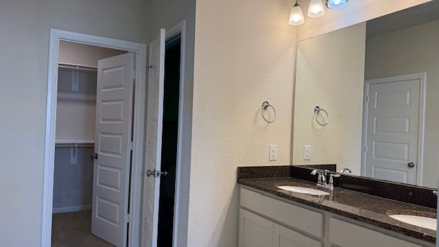3822 Supremes Trail Spring, TX 77386 - Photo 16 of 40 a bathroom with a granite countertop sink and a mirror