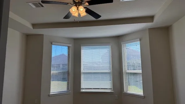 a view of an empty room with a window