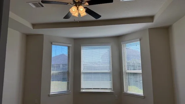 a view of an empty room with a window