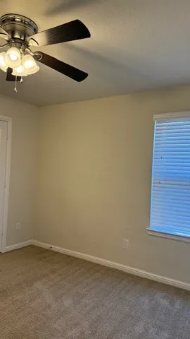 a bathroom with a granite countertop toilet a sink and bathtub