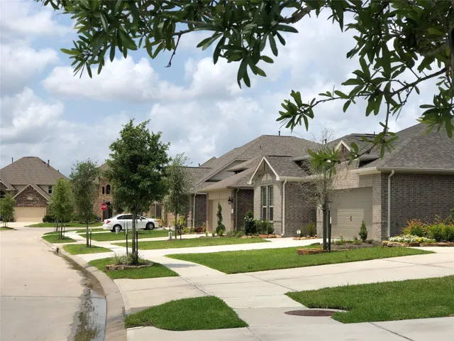 a swimming pool with outdoor seating and yard