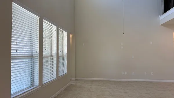 a view of wooden floor and brick walls