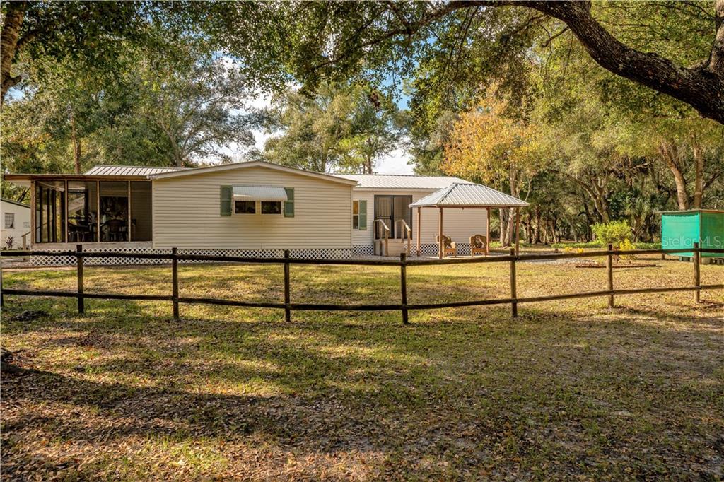 PRICED TO SELL! Spacious 3 bedroom, 2 bath triple-wide manufactured home on over 5 acres in Arcadia.