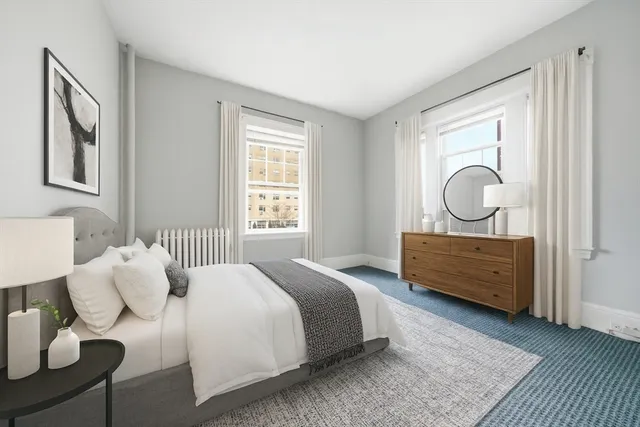 a bed room with a bed and a window