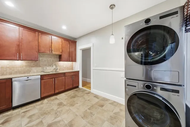 a kitchen with a washer and dryer