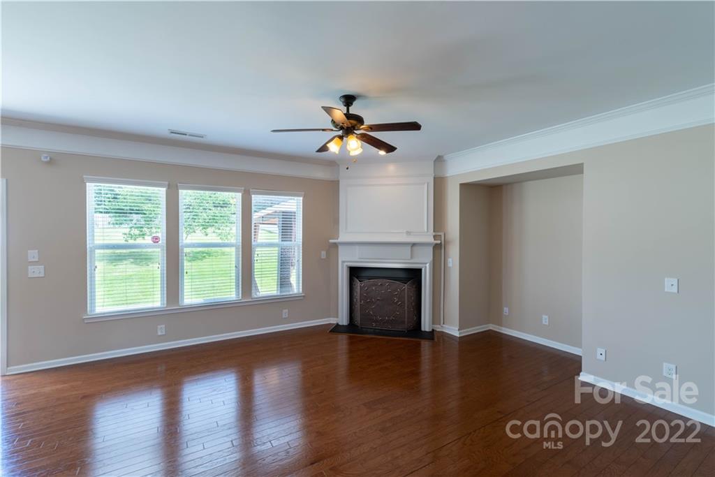 8115 Red Water Road Charlotte, NC 28277 - Photo 12 of 25 a view of an empty room with wooden floor and a window