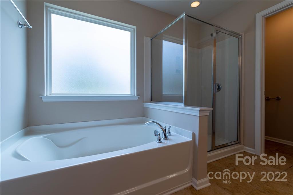 8115 Red Water Road Charlotte, NC 28277 - Photo 23 of 25 a bathroom with a bathtub and a shower