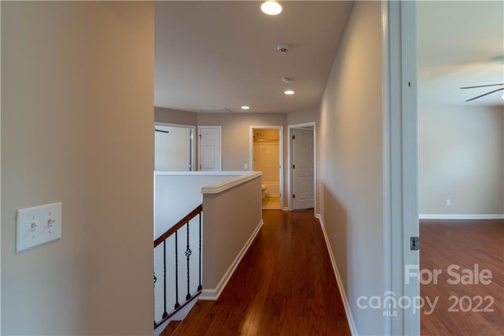 8115 Red Water Road Charlotte, NC 28277 - Photo 24 of 25 a view of a hallway with wooden floor and staircase