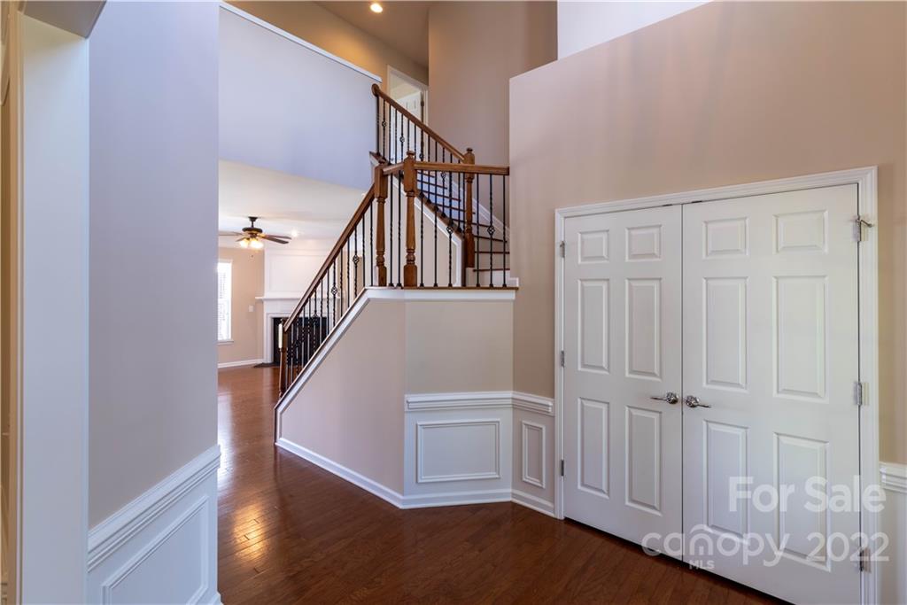 8115 Red Water Road Charlotte, NC 28277 - Photo 7 of 25 a view of entryway with stairs and wooden floor