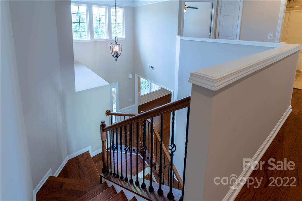 8115 Red Water Road Charlotte, NC 28277 - Photo 10 of 25 a view of entryway with stairs and wooden floor