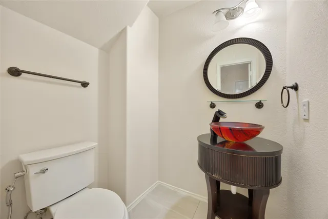 a bathroom with a toilet and a sink