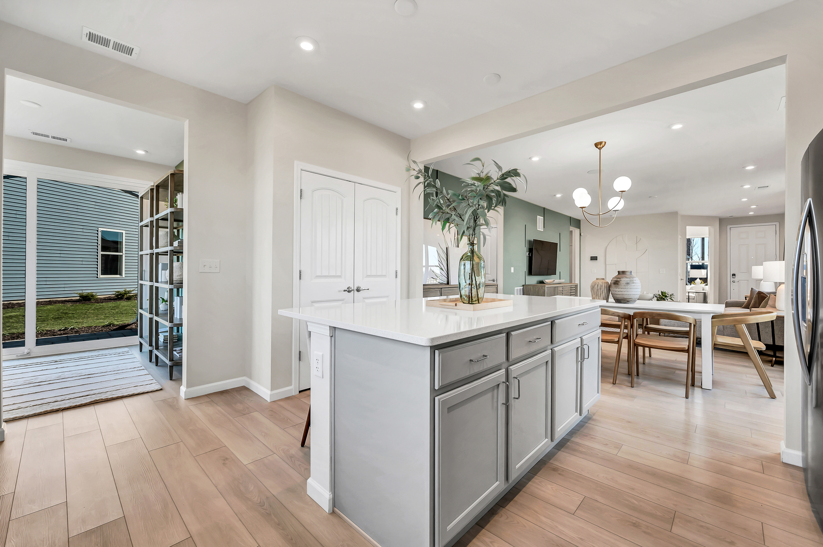 3219 Sweetgrass Circle Aurora, IL 60503 - Photo 2 of 11 a large kitchen with kitchen island a sink a center island and a stove