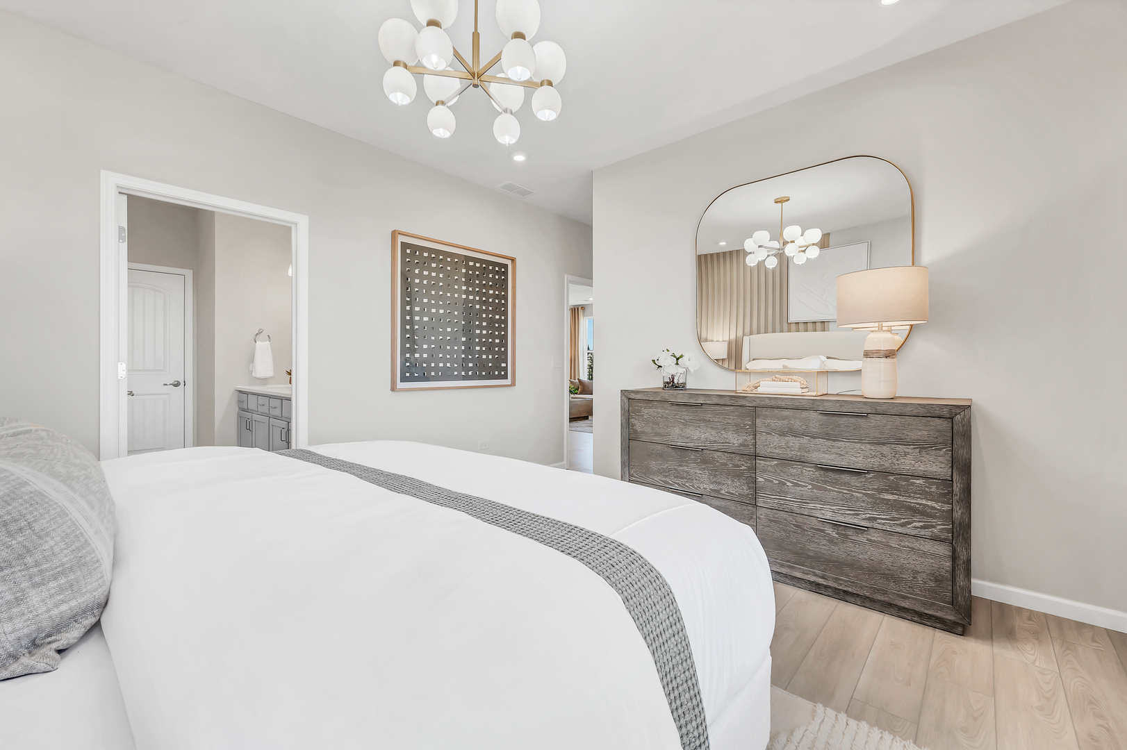 3219 Sweetgrass Circle Aurora, IL 60503 - Photo 8 of 11 a bedroom with a bed and a chandelier