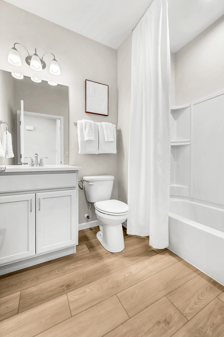 3219 Sweetgrass Circle Aurora, IL 60503 - Photo 10 of 11 a bathroom with a sink a toilet and a bathtub