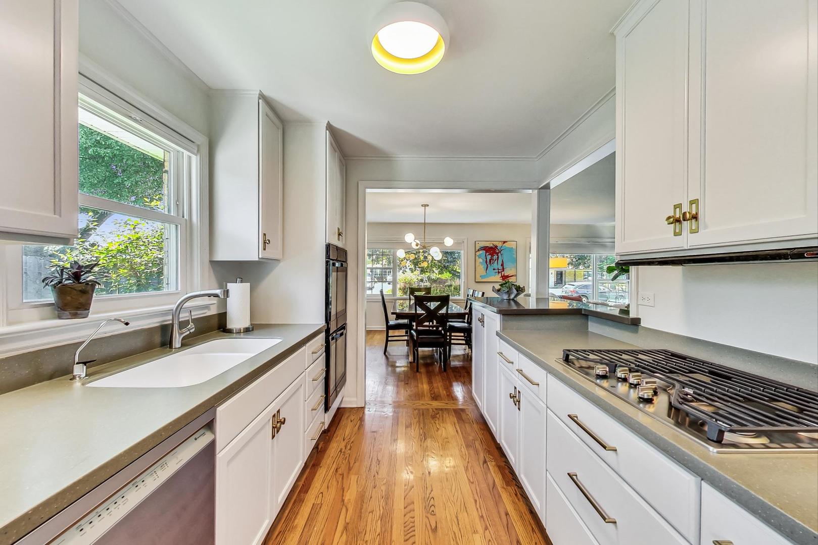 1340 Pendleton Lane Glenview, IL 60025 - Photo 11 of 39 a kitchen with stove and cabinets