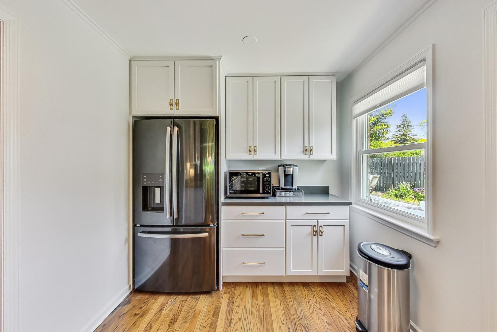 1340 Pendleton Lane Glenview, IL 60025 - Photo 12 of 39 a kitchen with a refrigerator and a stove