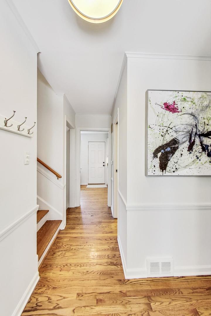 1340 Pendleton Lane Glenview, IL 60025 - Photo 14 of 39 a view of a room with wooden floor
