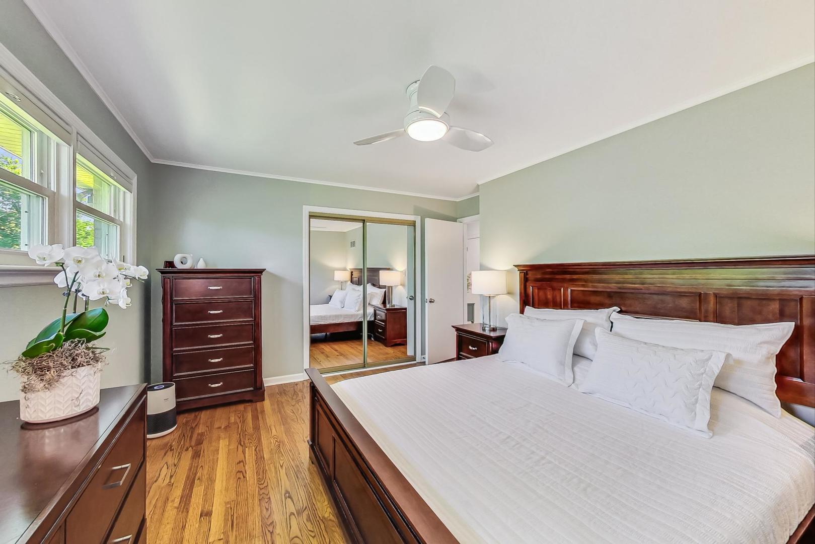 1340 Pendleton Lane Glenview, IL 60025 - Photo 17 of 39 a bedroom with a bed and a flat tv screen