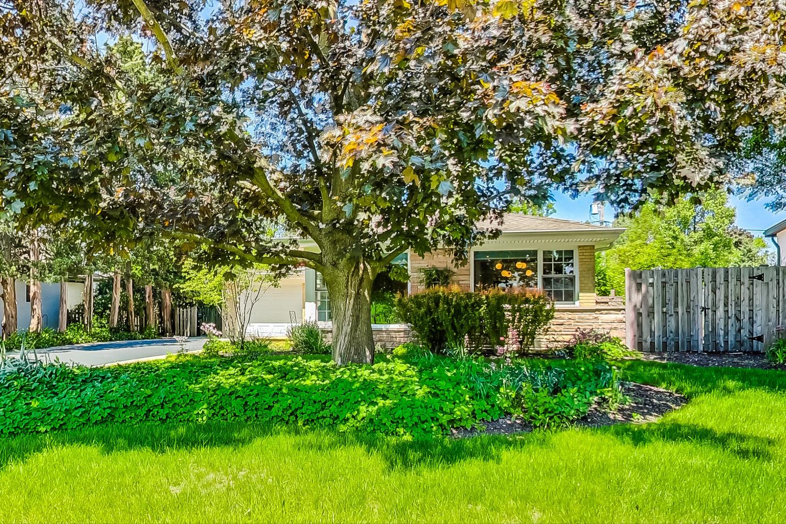1340 Pendleton Lane Glenview, IL 60025 - Photo 2 of 39 a front view of a house with garden