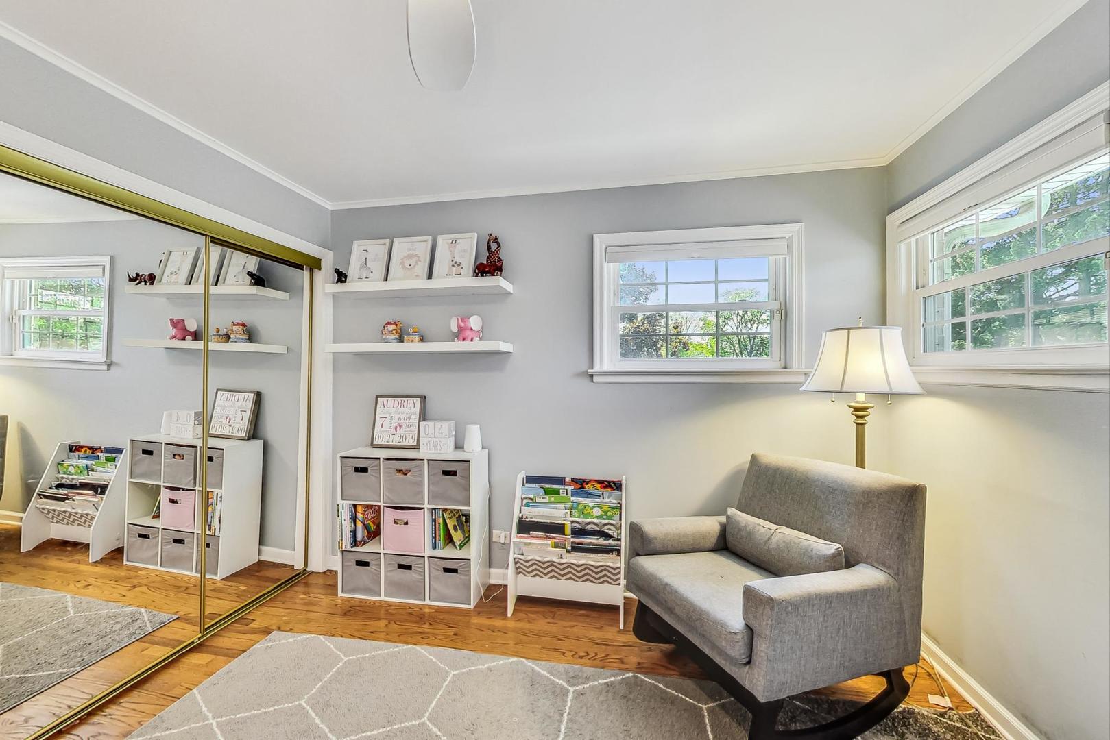 1340 Pendleton Lane Glenview, IL 60025 - Photo 22 of 39 a living room with furniture and a window