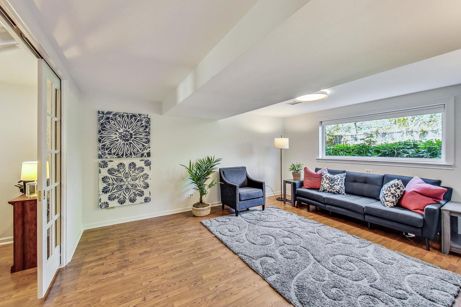 1340 Pendleton Lane Glenview, IL 60025 - Photo 25 of 39 a living room with furniture and a large window
