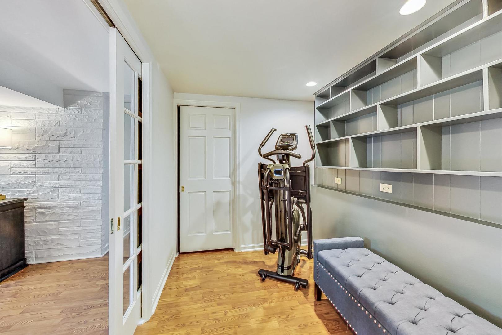 1340 Pendleton Lane Glenview, IL 60025 - Photo 29 of 39 a view of walk in closet with clothes and shoes