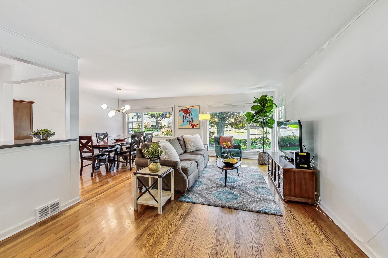1340 Pendleton Lane Glenview, IL 60025 - Photo 7 of 39 a living room with furniture and a wooden floor