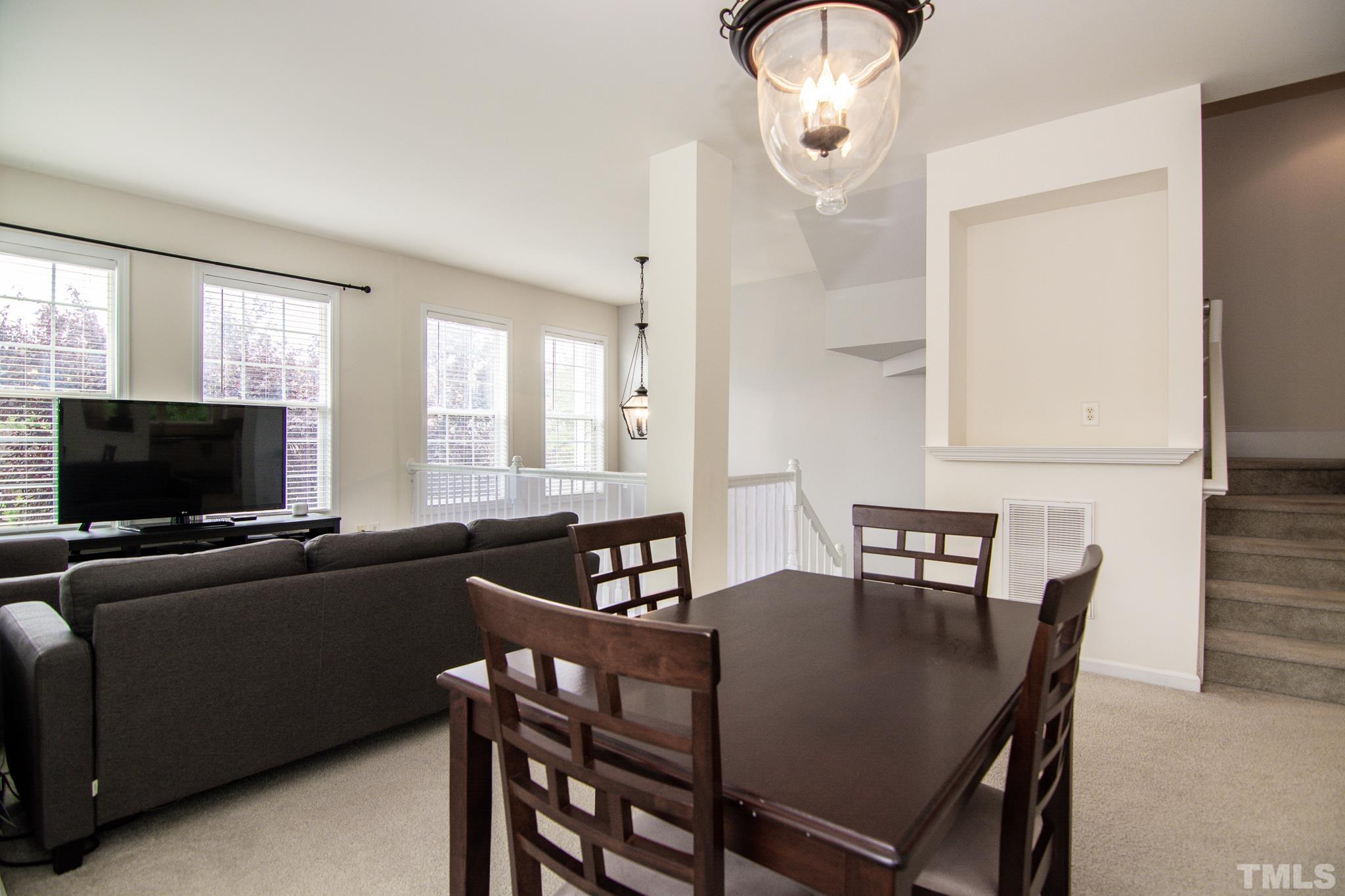 8120 Upper Lake Drive Raleigh, NC 27615 - Photo 11 of 29 a living room with furniture and a flat screen tv