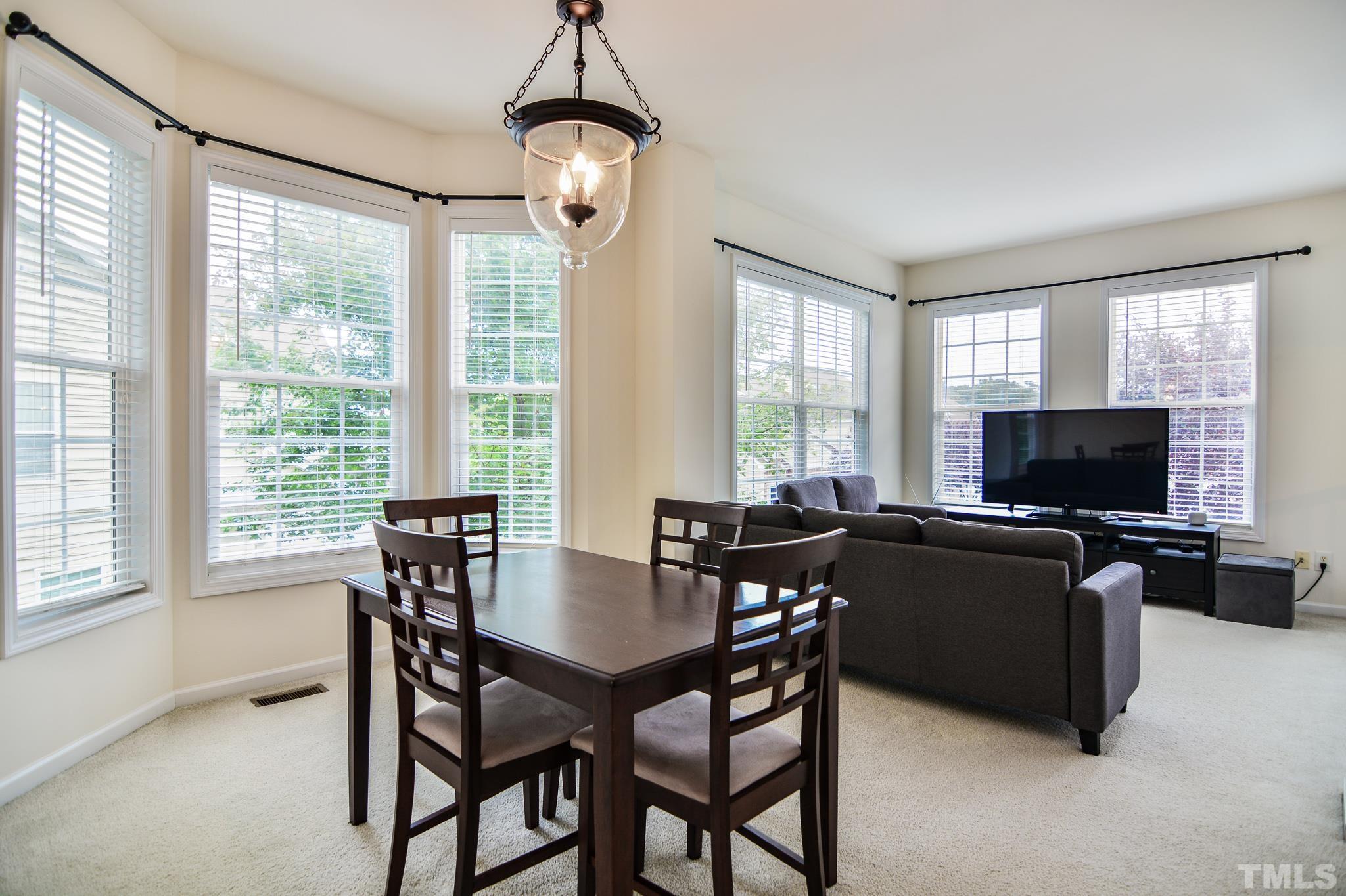 8120 Upper Lake Drive Raleigh, NC 27615 - Photo 12 of 29 a view of a dining room with furniture window and outside view