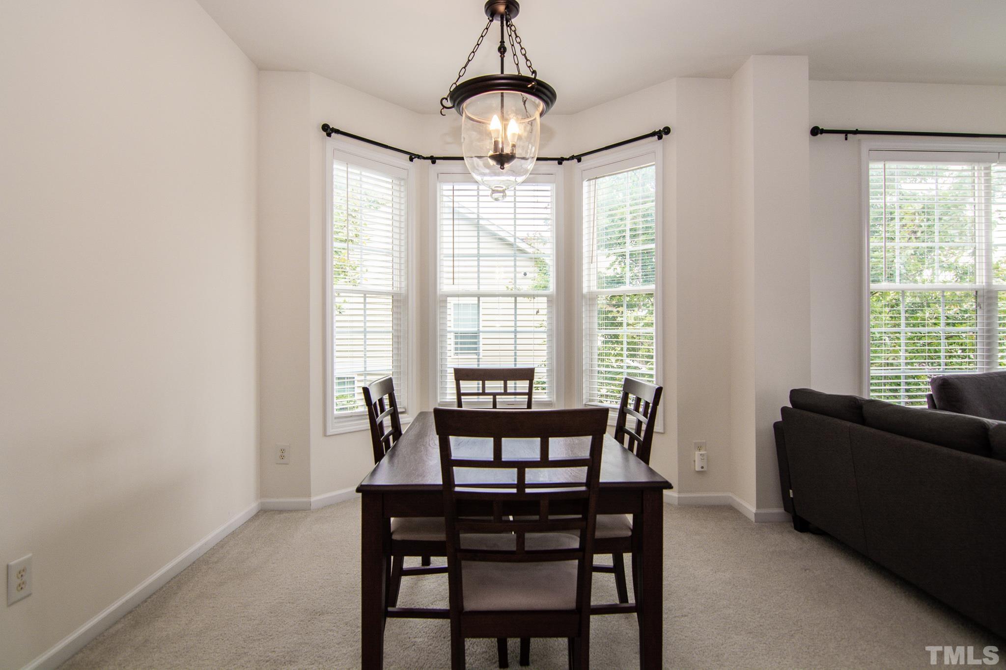 8120 Upper Lake Drive Raleigh, NC 27615 - Photo 13 of 29 a dining room with furniture and window