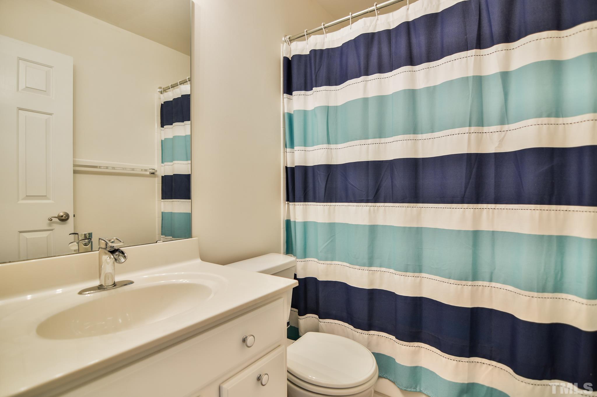 8120 Upper Lake Drive Raleigh, NC 27615 - Photo 17 of 29 a bathroom with a sink and a mirror