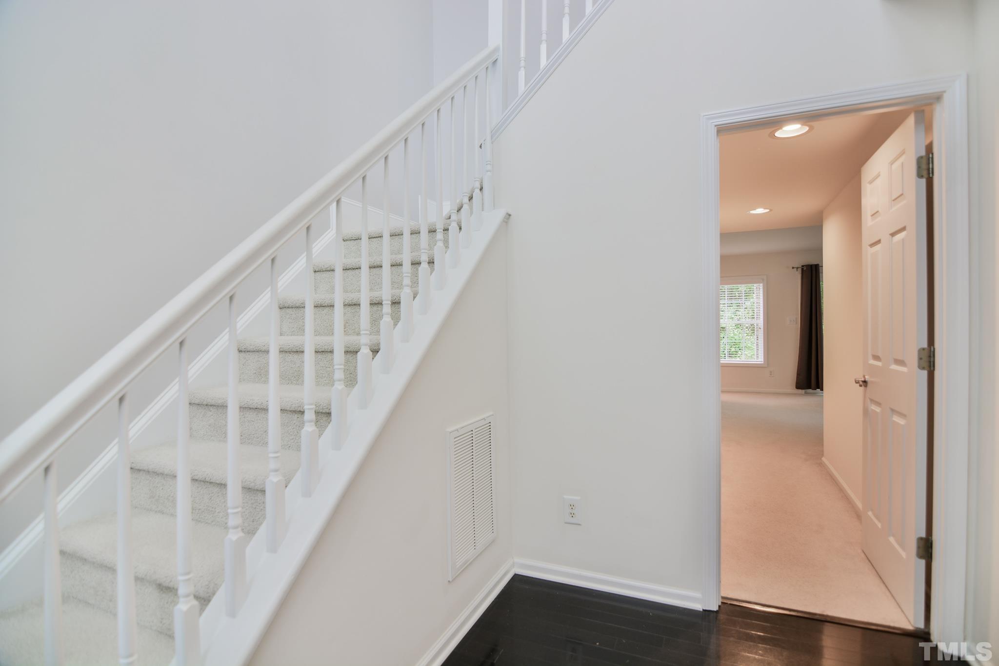 8120 Upper Lake Drive Raleigh, NC 27615 - Photo 19 of 29 a view of entryway with wooden floor
