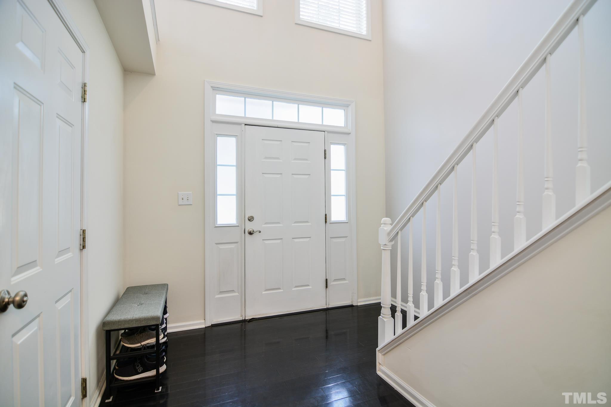 8120 Upper Lake Drive Raleigh, NC 27615 - Photo 20 of 29 a view of a hallway with wooden floor and staircase