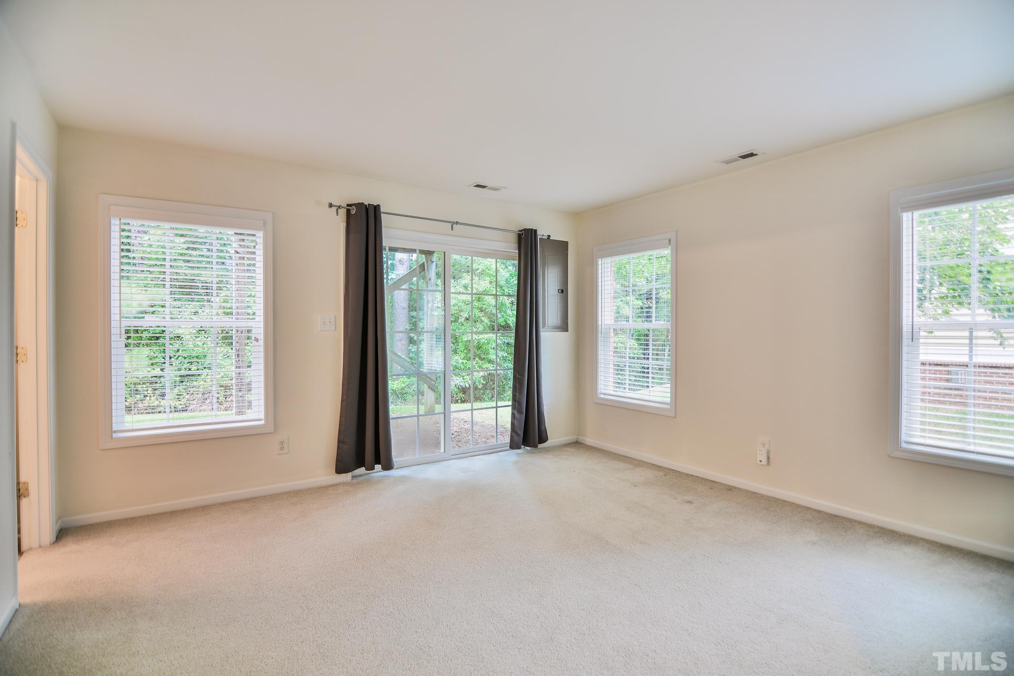 8120 Upper Lake Drive Raleigh, NC 27615 - Photo 21 of 29 a view of an empty room with a window