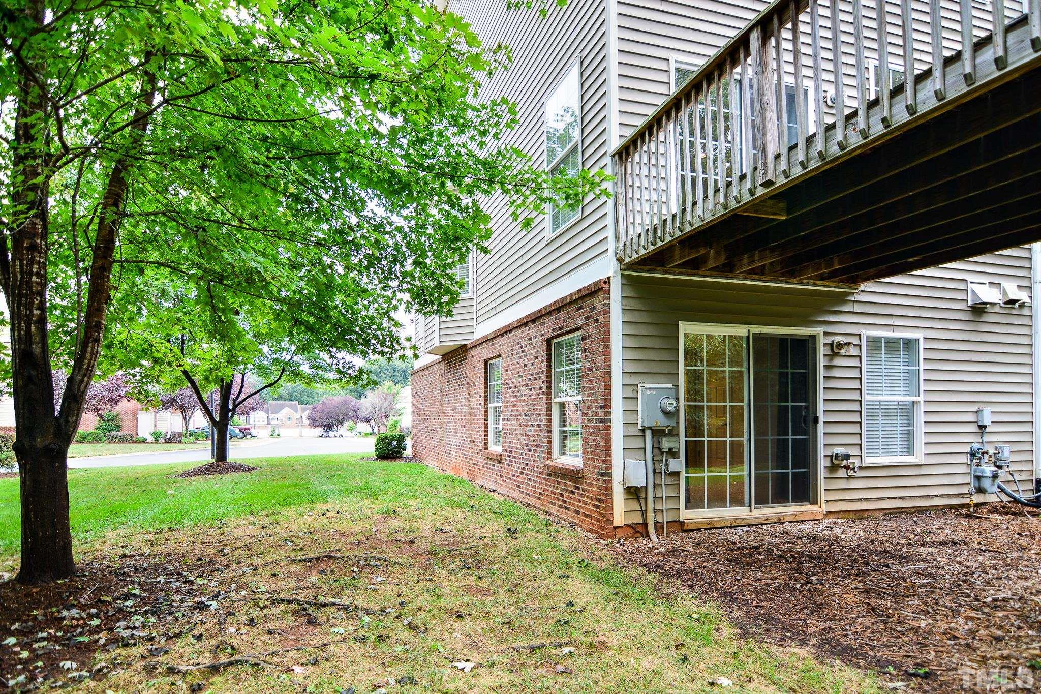 8120 Upper Lake Drive Raleigh, NC 27615 - Photo 24 of 29 a view of a house with a yard