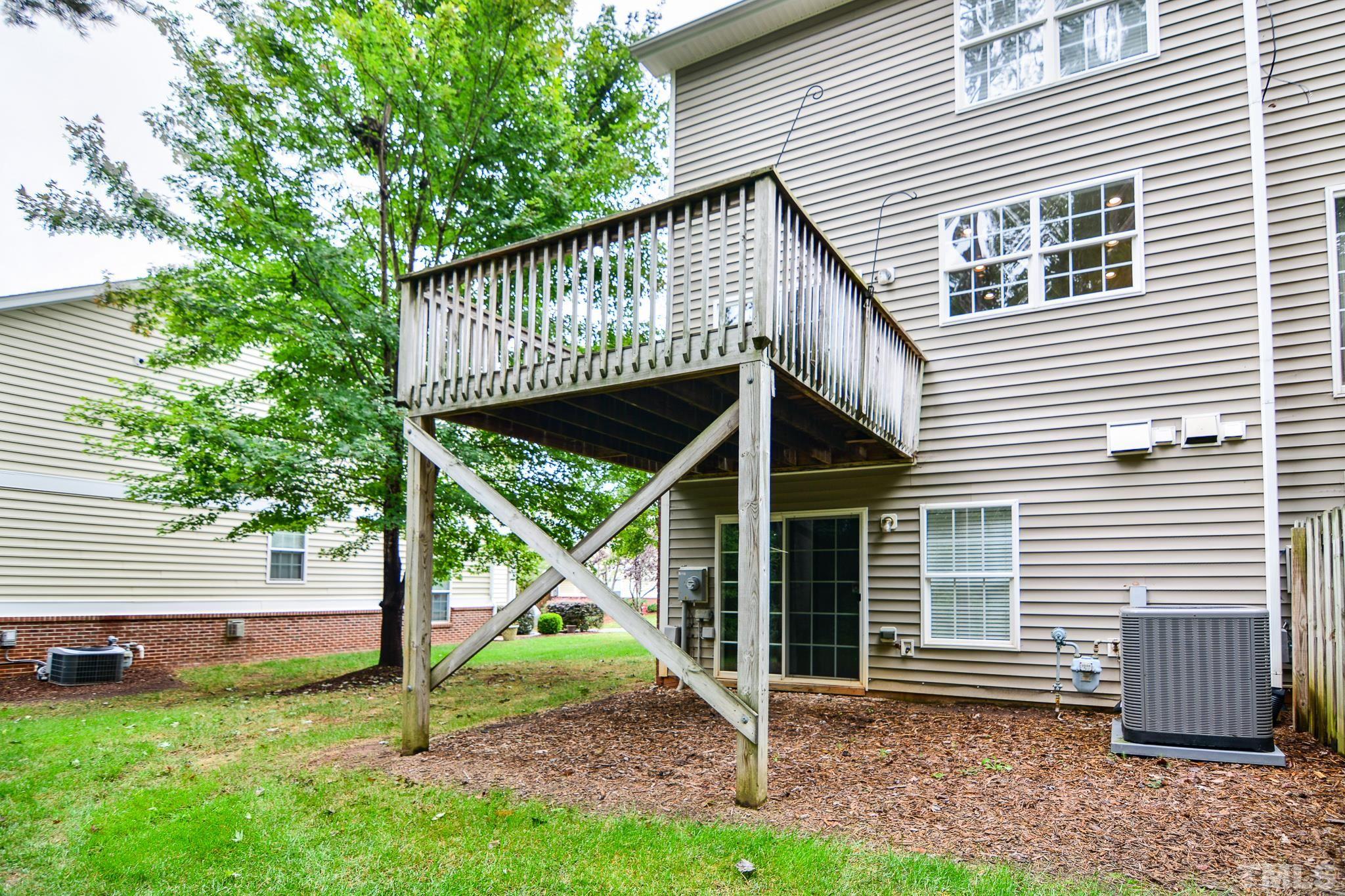 8120 Upper Lake Drive Raleigh, NC 27615 - Photo 26 of 29 a view of a house with a yard