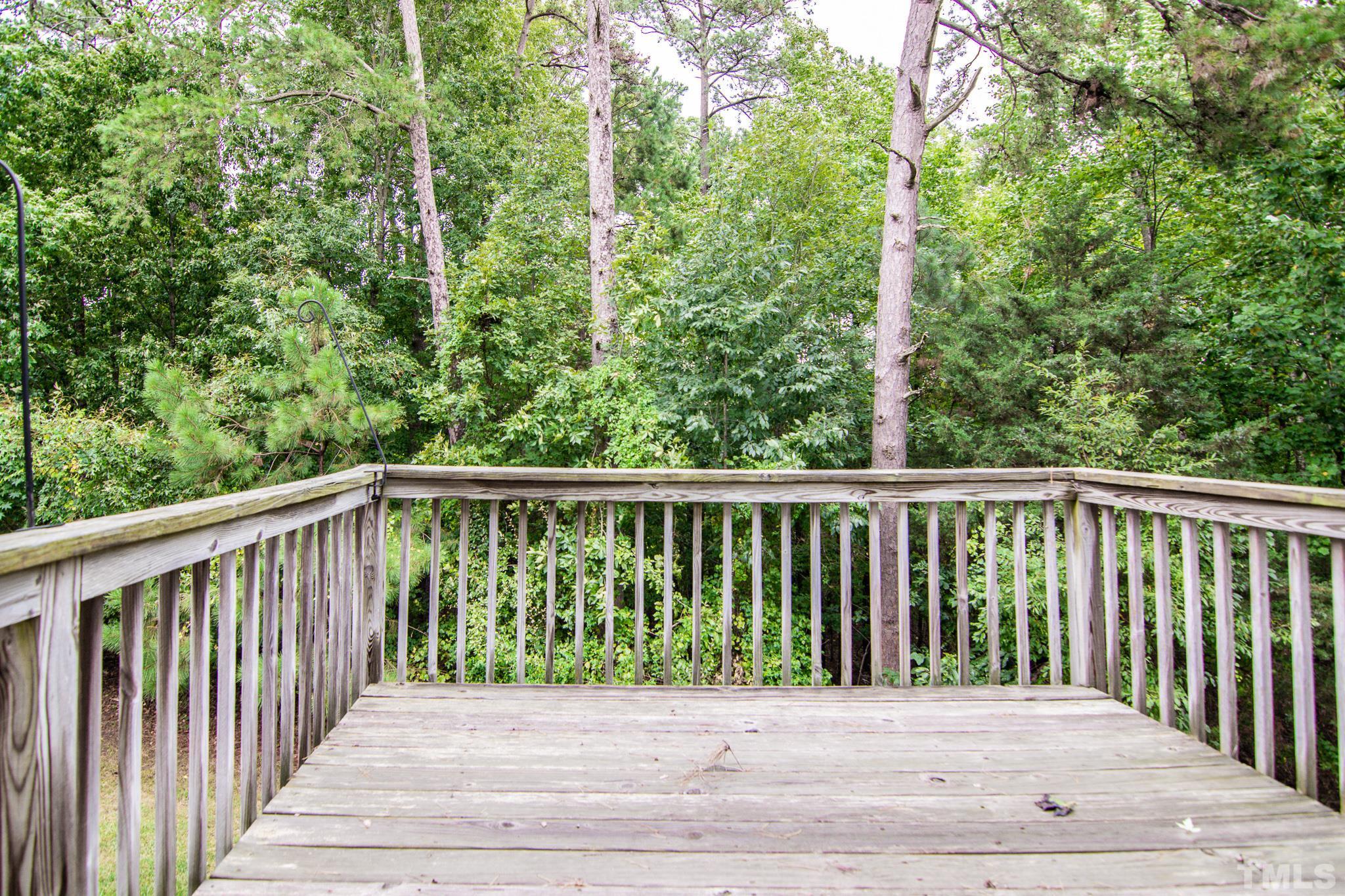 8120 Upper Lake Drive Raleigh, NC 27615 - Photo 28 of 29 a view of a wooden roof deck