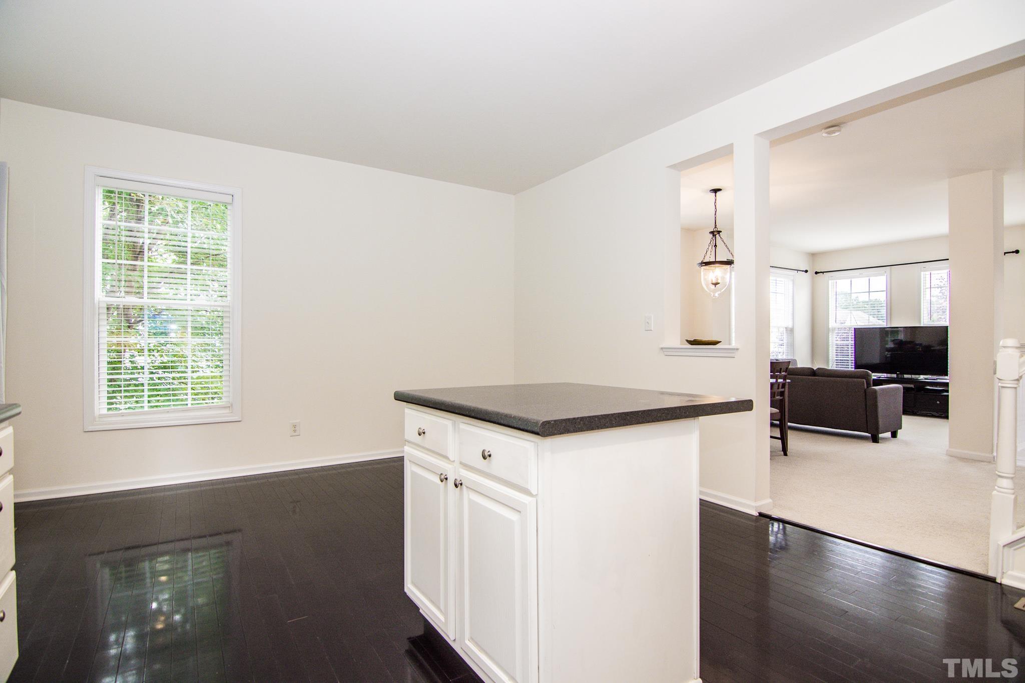 8120 Upper Lake Drive Raleigh, NC 27615 - Photo 9 of 29 a kitchen with a stove a sink and a refrigerator